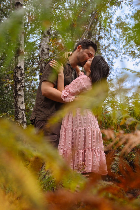 Joyful engagement photoshoot in Buckinghamshire woodlands by Win.Co Photography, perfect for adventurous couples.