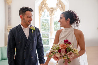 Bride and groom sharing first dance under fairy lights in Berkshire barn, captured by Win.Co Photography, showing romance, movement, and warm evening tones.