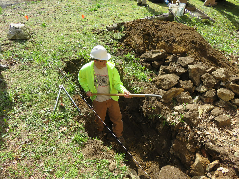Digging archaeological test pit