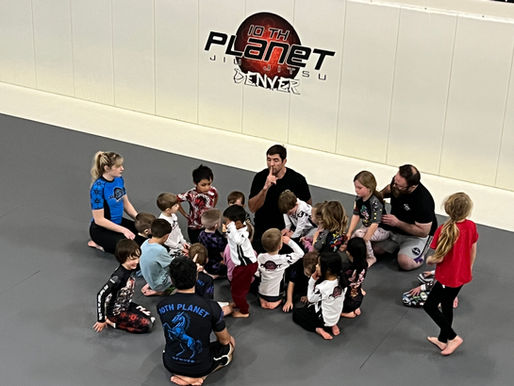 instructor in front of kid's class