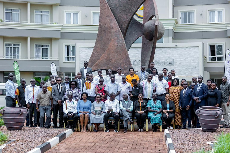 Top Management group photo infront of the new Crested Crane Hotel in Jinja