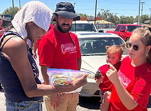 Compassion Church volunteers serving and connecting with the community during an outdoor outreach event in Albuquerque.