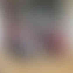 teachers with Lovepack students making heart shape with hands