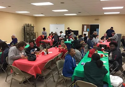 More Than A Meal participants enjoying a Christmas party.