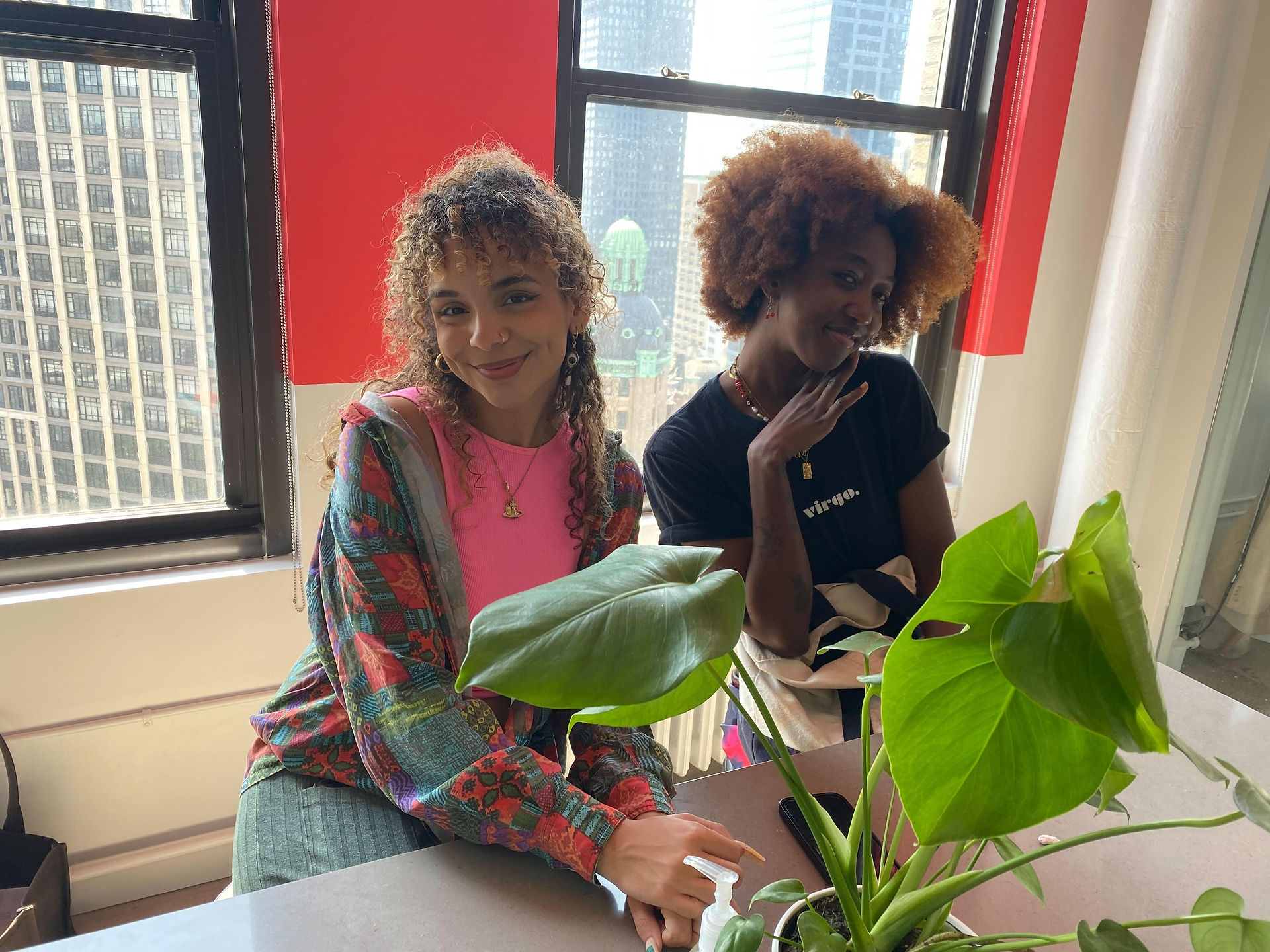 Two female Blac, Inc., interns smiling at the camera. 