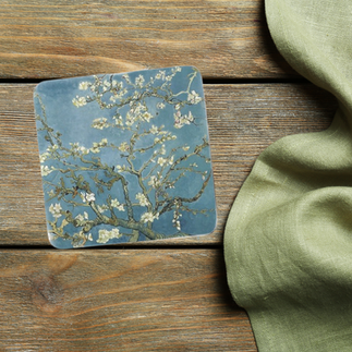 A drinks coaster featuring Vincent Van Gogh's famous Almond Blossom design