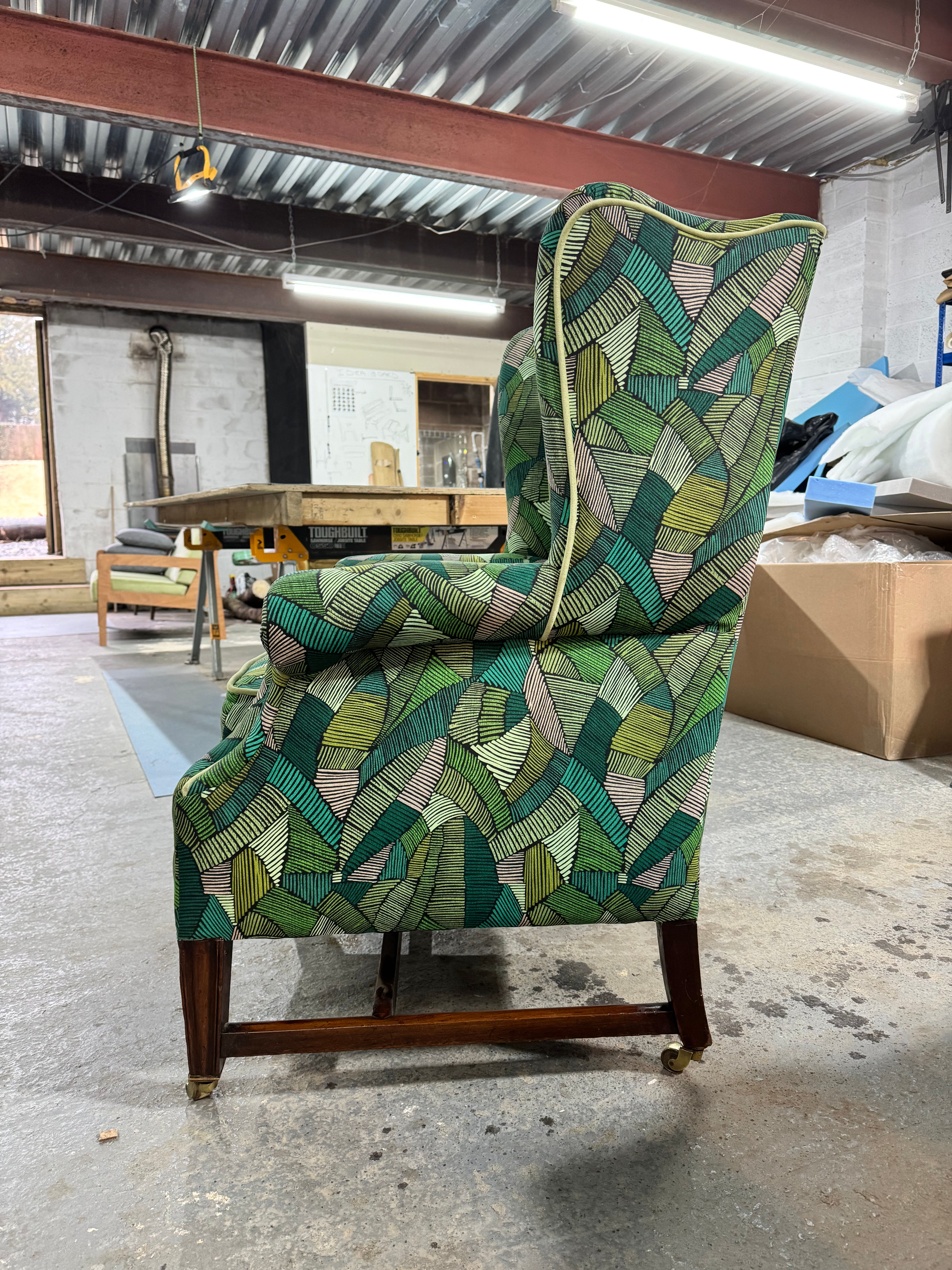 Wonderfully upholstered antique wingback