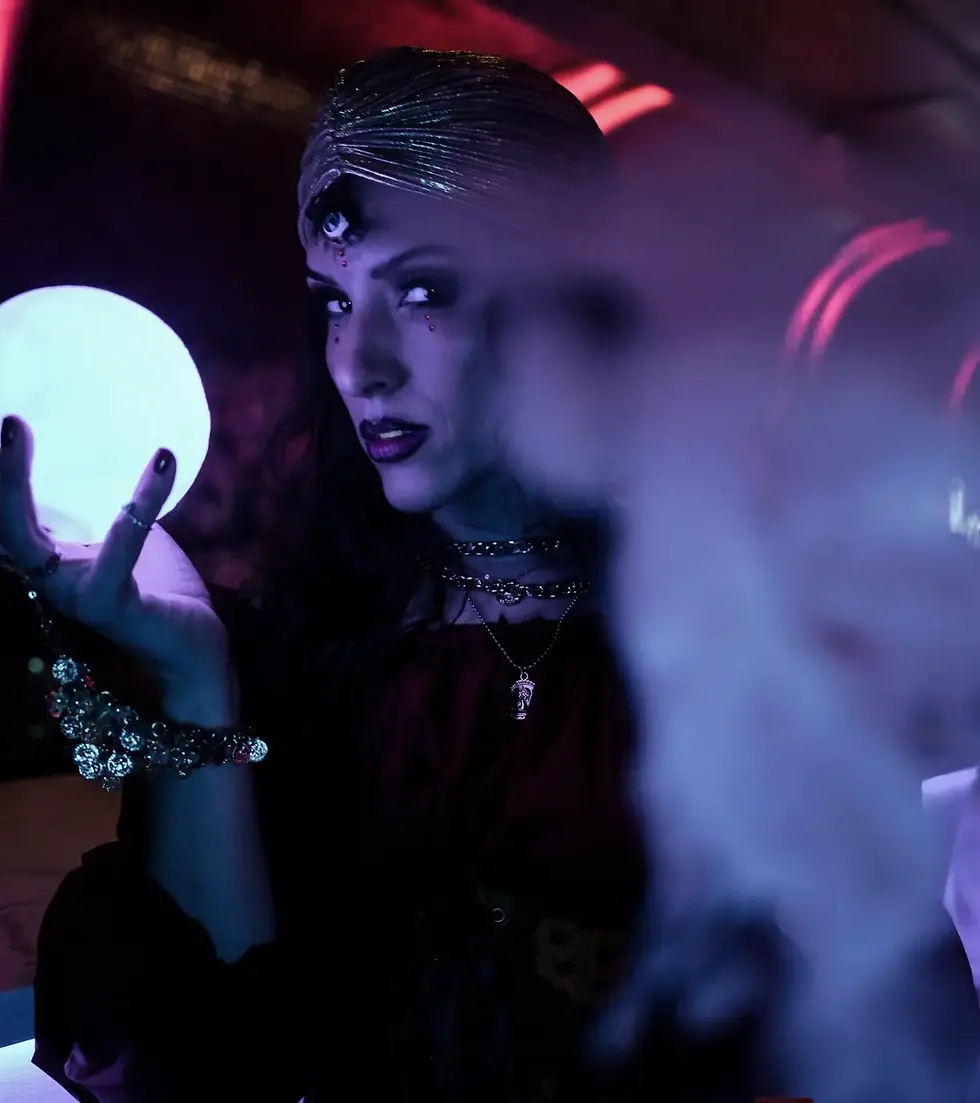 Halloween character holding a glowing orb at The Haunted Circus at HK Hall in 2025.