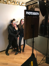 posing in front of Photo Booth