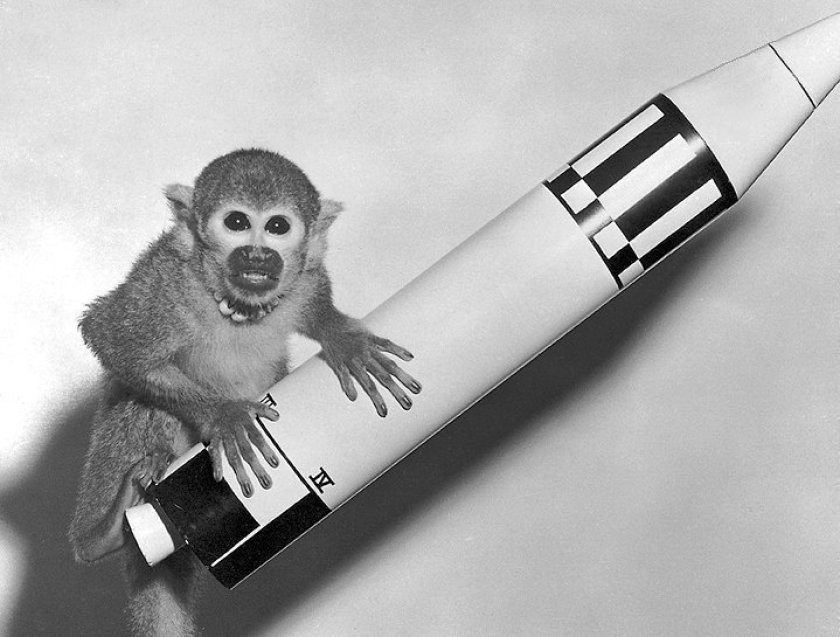 Miss Baker with model Jupiter rocket