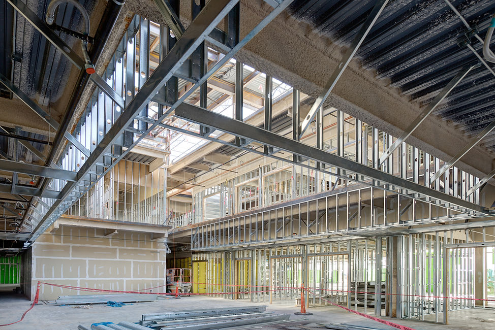 Steel studs used to frame in a large com