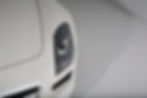 closeup-shot-headlights-modern-white-car.jpg