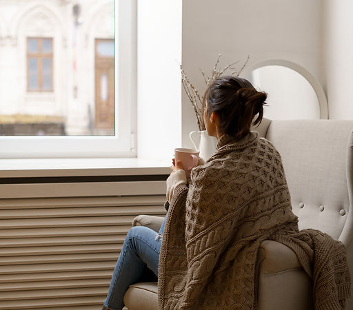 smiling-lady-smart-trendy-wear-is-sitting-armchair-with-cup-tea.jpg