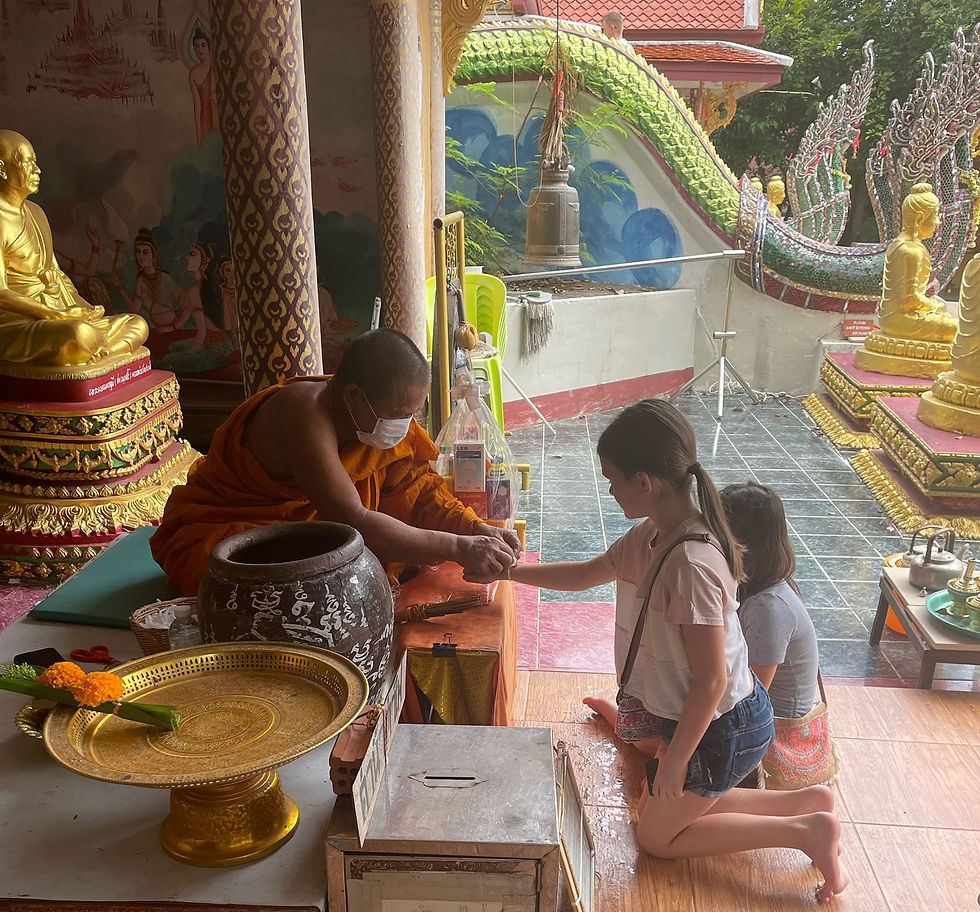 Girls getting blessed by monk in Koh Samui