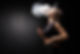 young-sexy-woman-is-vaping-smoking-e-cigarette-cloud-vapor-black-wall.jpg