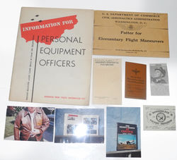 Small grouping to a USAAF/USAF pilot includes manuals and badges.