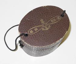 Imperial Japanese Navy flying goggles in box with cleaning cloth