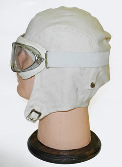 Dashing period-looking white helmet and goggles