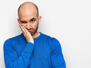 Sad bald man