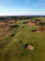 The 18th Hole at Sand Valley with the Gallery at Craig's Porch up ahead overlooking the green.