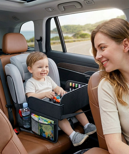 Child using Nurtured Nest leather car seat activity tray on a road trip
