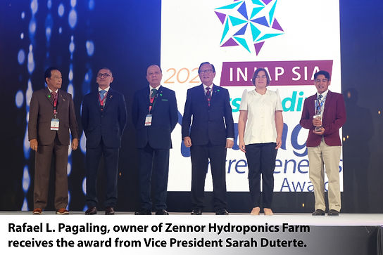 Rafael L. Pagaling, owner of Zennor Hydroponics Farm receives the award from Vice Presiden