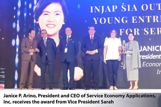 Janice P. Arino, President and CEO of Service Economy Applications, Inc. receives the awar