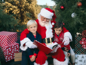 santa reading a red book to two little boys photo by LoLo Spencer Photography