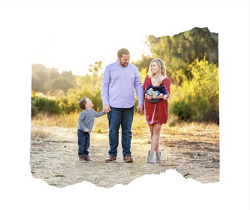 family of four walking along a path