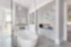 Elegant bathroom with fireplace and bathtub in new luxury home.jpg