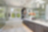 Contemporary master bathroom features a dark dual vanity cabinet , glass walk-in shower, d