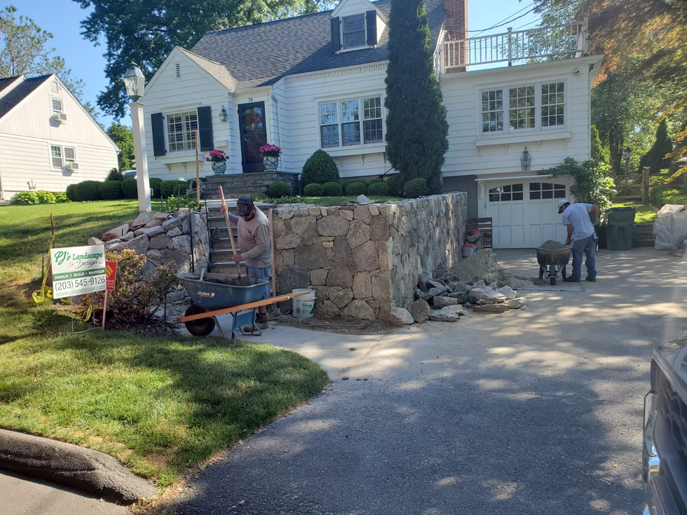 Stone wall installation.jpeg