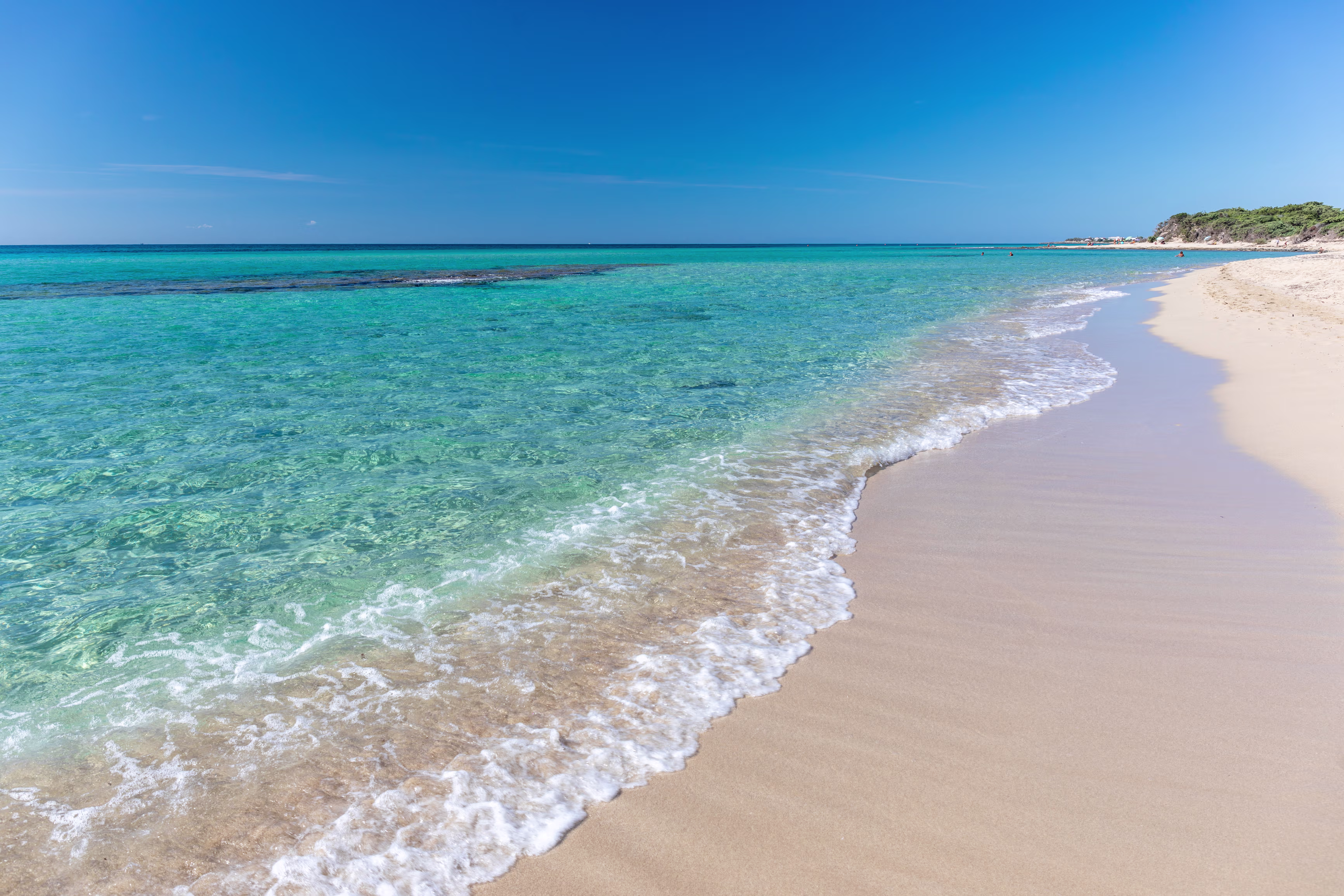 A scenic view of a beautiful beach with transparent water in Porto Cesareo