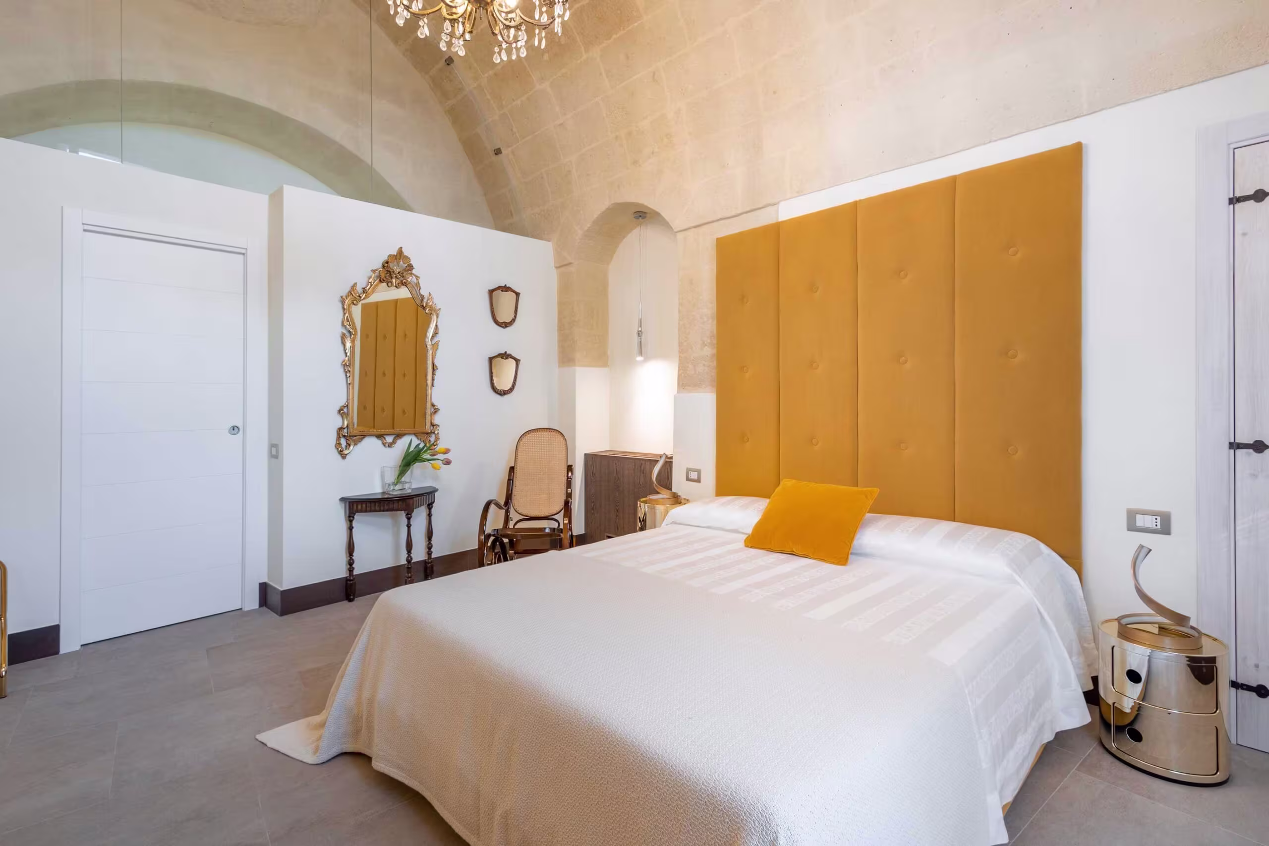 yellow spacious bedroom at L'antica conceria in Matera, Italy