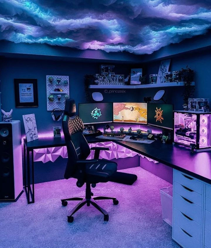 Futuristic gaming setup with neon lighting, triple monitors, and a sleek chair. Ceiling mimics glowing clouds. Cozy and immersive vibe.