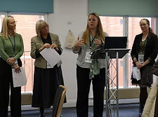 Network coordinators presenting at a conference