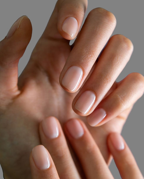 Young woman's hands with colorful and decorated nail manicure with different modern and in