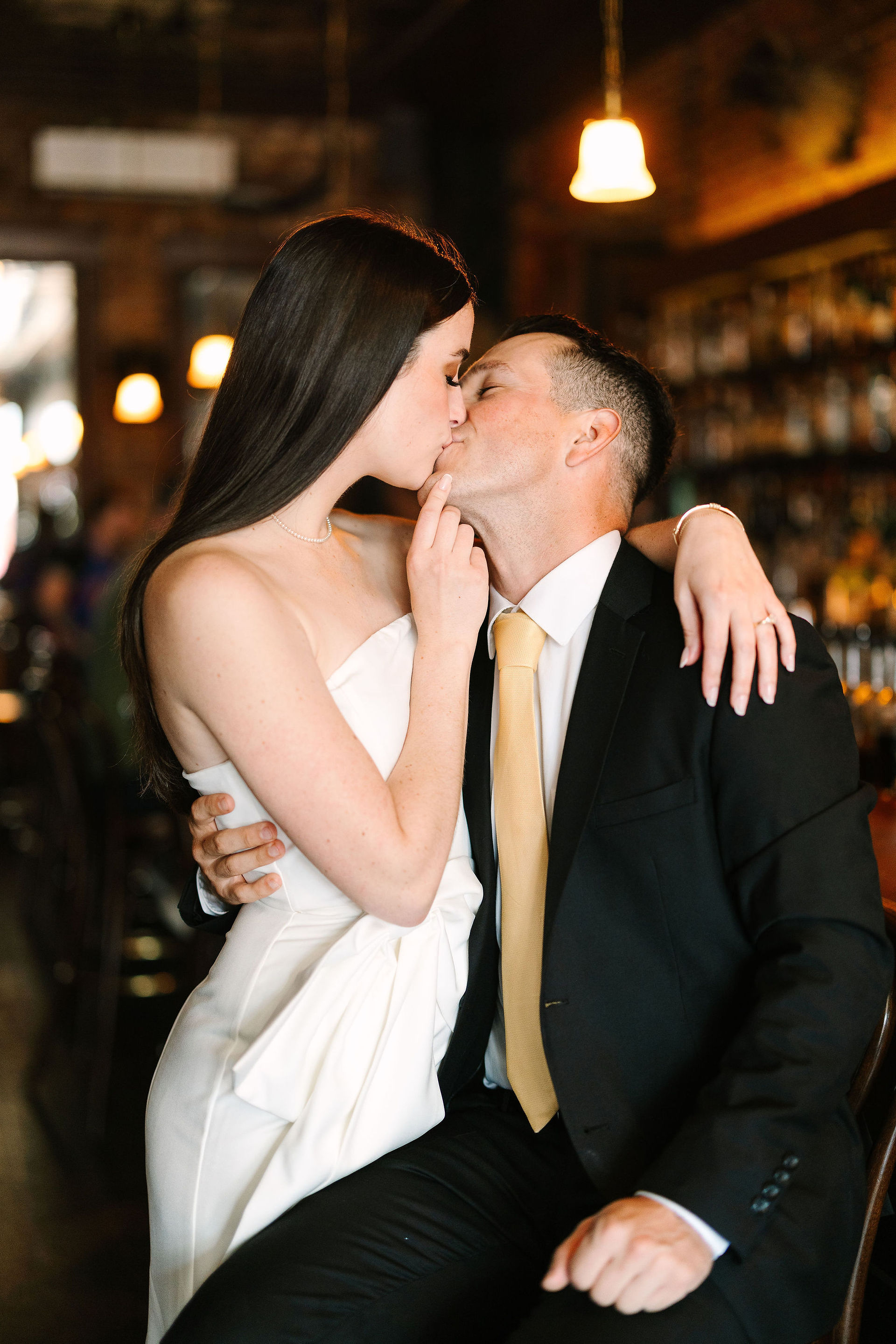 Romantic bar engagement photos at Sugar House in Detroit with moody lighting