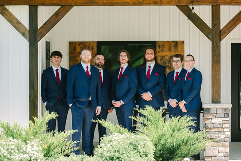 Wedding photographer capturing bride and groom portraits at Creekside Acres Event Barn in Goodrich, Michigan.