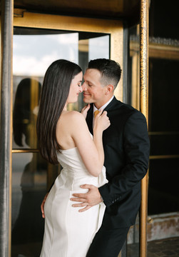 Couple walking through Fisher Building Detroit during engagement photos