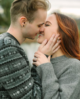 Alyssa and Jacob posing together during a fall engagement session on Belle Isle in Detroit