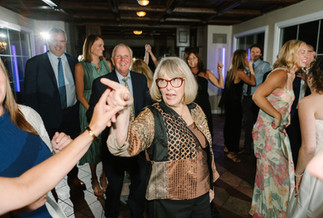 Bride and groom dancing at Pine Knob Mansion reception during early fall wedding