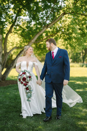 Wedding photographer capturing bride and groom portraits at Creekside Acres Event Barn in Goodrich, Michigan.