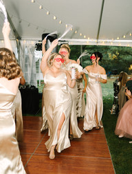 Michigan backyard wedding inspiration featuring an intimate outdoor ceremony under trees with white drapery and greenery