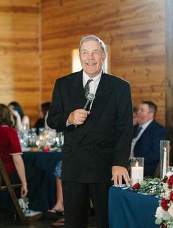 Emotional wedding speeches during the reception at Creekside Acres Event Barn in Goodrich, MI.