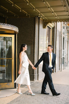 Couple walking through Fisher Building Detroit during engagement photos