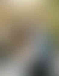 Couple walking through snowy courtyard during Ann Arbor winter engagement photos