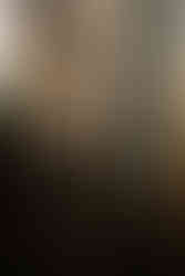 Romantic engagement photo of couple exploring the vintage book aisles at John King Books Detroit