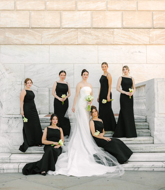 Bride and groom wedding portraits on the white marble steps of the Detroit Institute of Arts