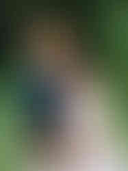 Couple celebrating their proposal at Nichols Arboretum in Ann Arbor, MI after she said yes Intimate proposal moment photographed at Nichols Arboretum, Ann Arbor with natural light